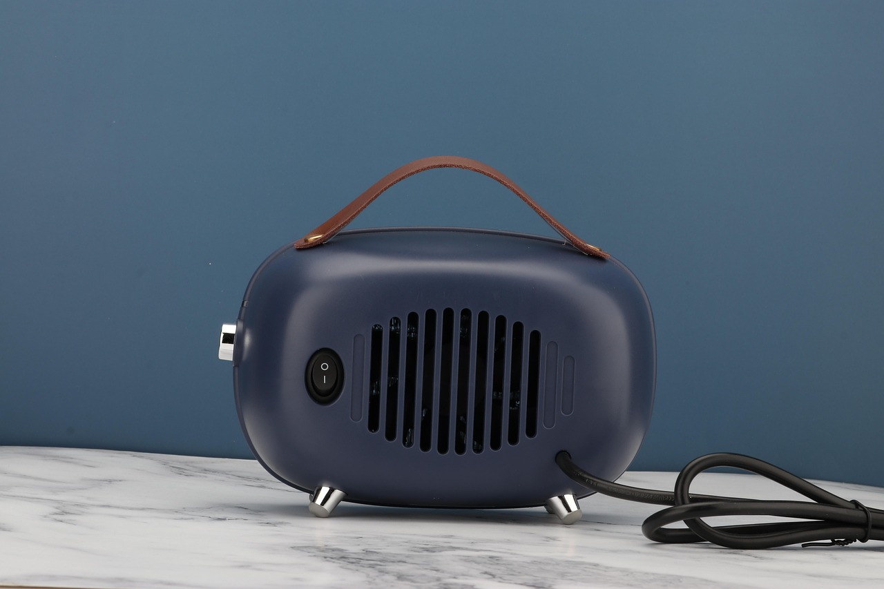 Photo featuring fan heater, portable heater, cortex, warm air blower