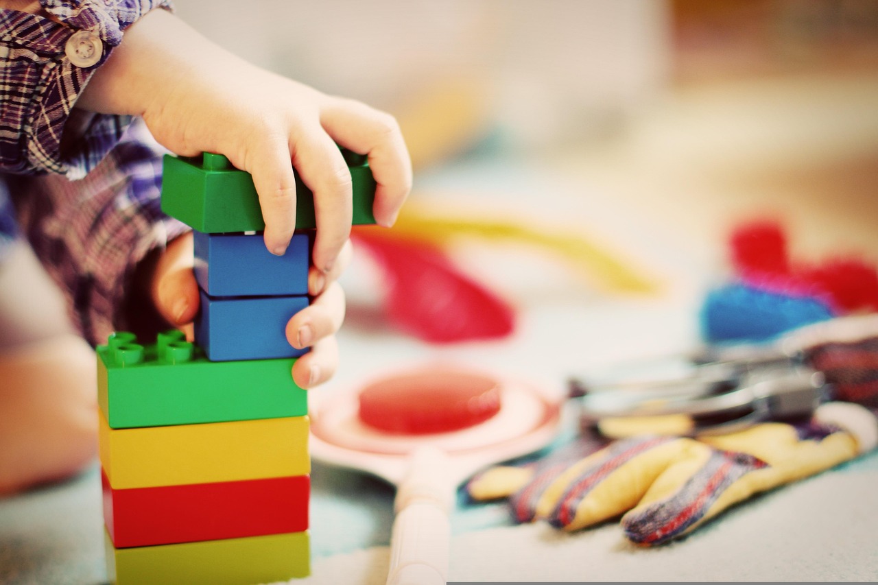 Photo featuring christmas background, child, tower, building blocks
